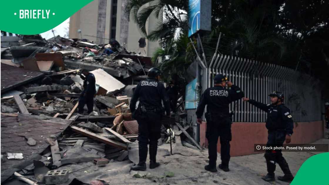 The photograph showed emergency personnel assessing a heavily damaged urban site filled with shattered concrete and debris