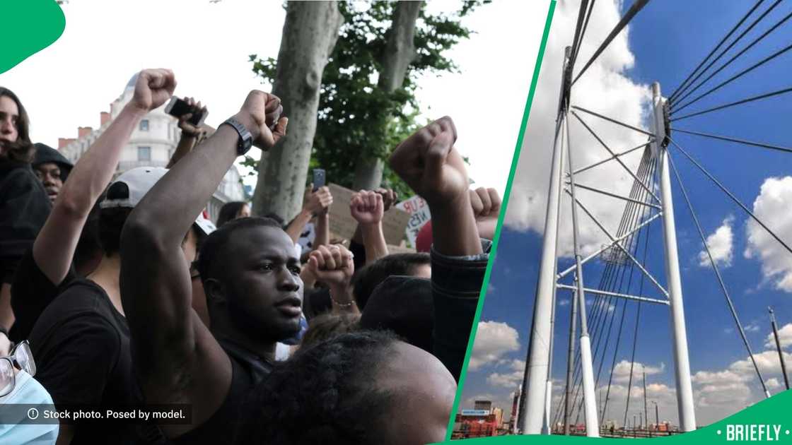 People stood in solidarity of seeing Nelson Mandela Bridge lit in purple. People stood in solidarity of seeing Nelson Mandela Bridge lit in purple.
