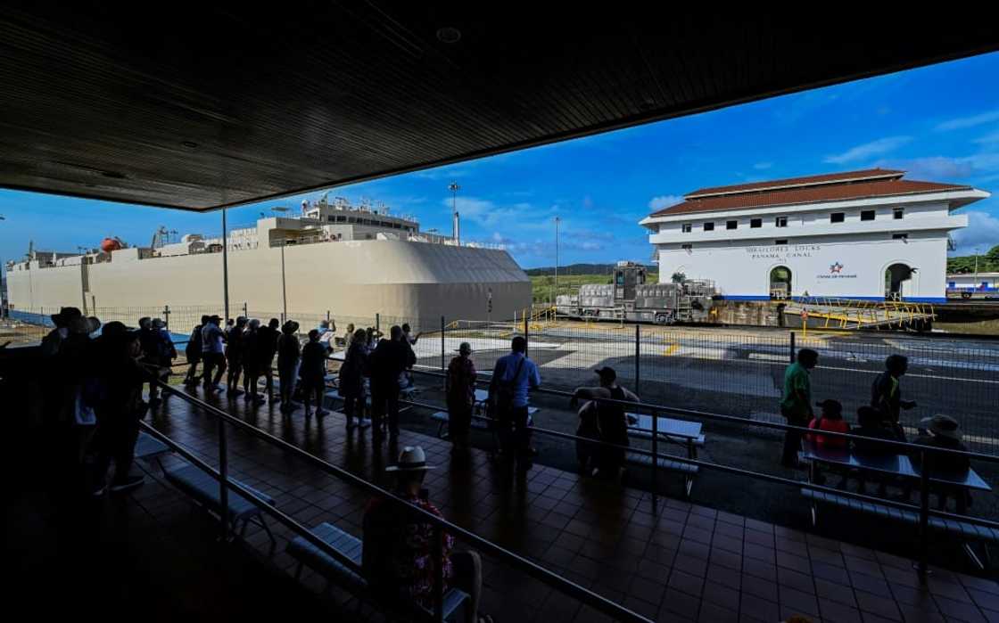 A ship passing through the Miraflores lock in the Panama Canal A ship passing through the Miraflores lock in the Panama Canal