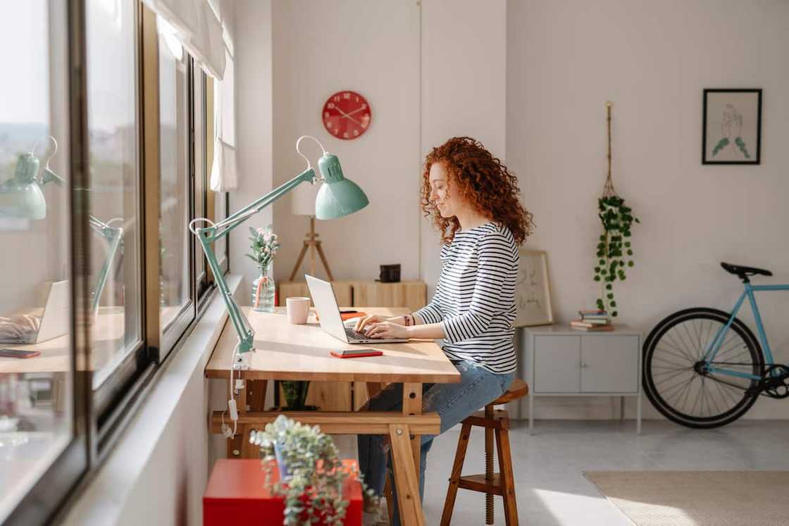 Woman working on a laptop at home