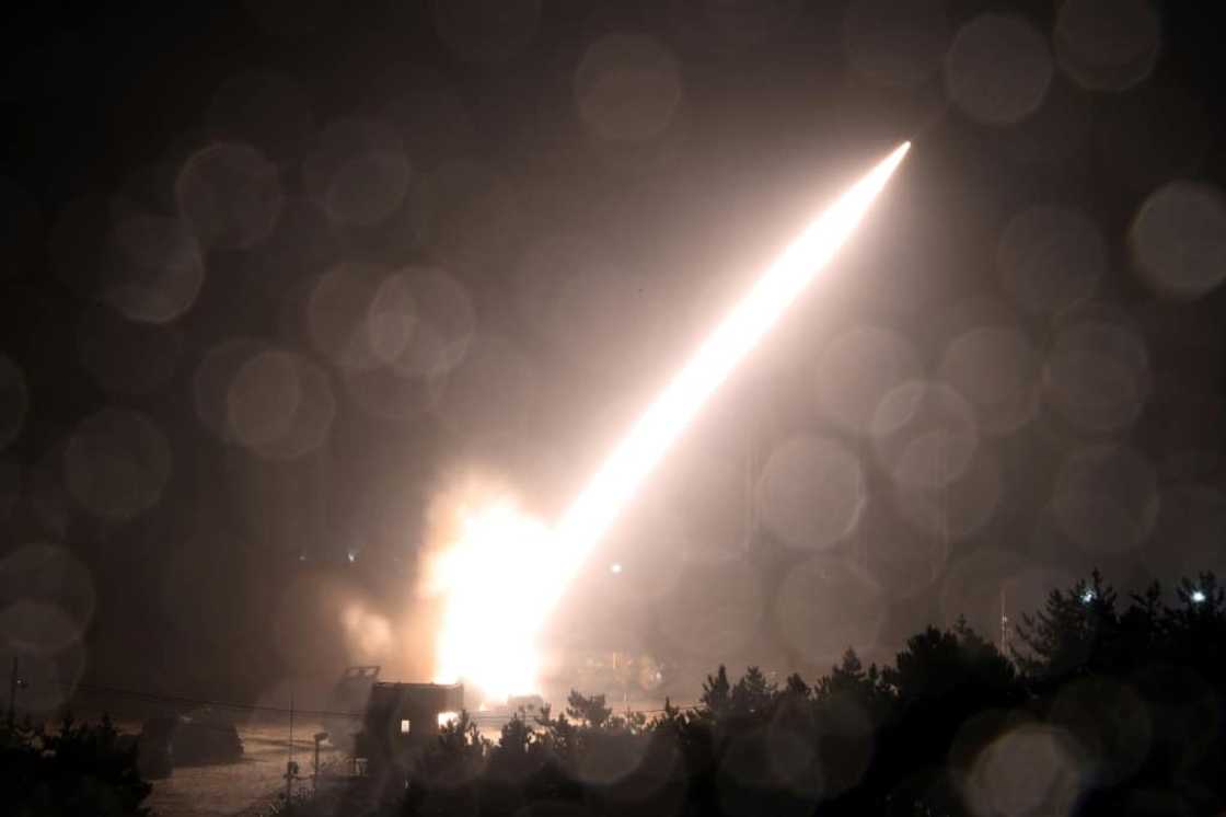 This handout photo taken on October 5, 2022 and released by South Korea's Defence Ministry in Seoul shows the Army Tactical Missile System (ATACMS) firing a missile from an undisclosed location on South Korea's east coast This handout photo taken on October 5, 2022 and released by South Korea's Defence Ministry in Seoul shows the Army Tactical Missile System (ATACMS) firing a missile from an undisclosed location on South Korea's east coast