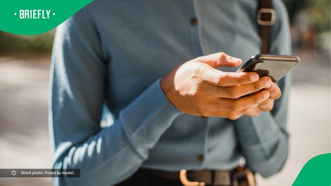 A woman typing on her phone.