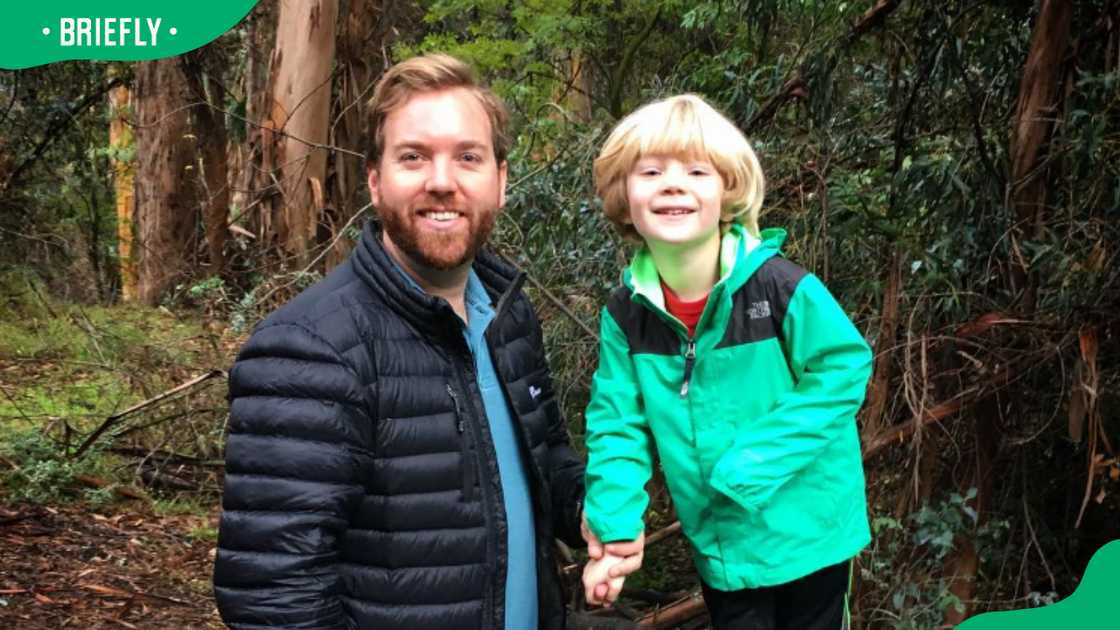Chad W. Murray and his son hiking.