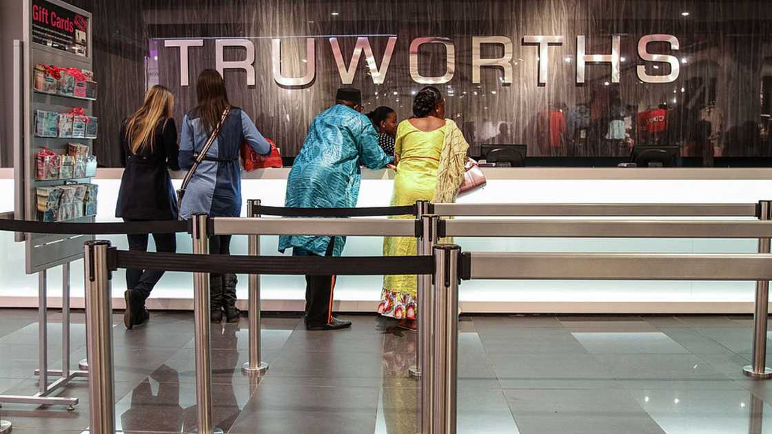 Customers stand at the check out counter inside a Truworths International Ltd. fashion store in Sandton, South Africa. Customers stand at the check out counter inside a Truworths International Ltd. fashion store in Sandton, South Africa.