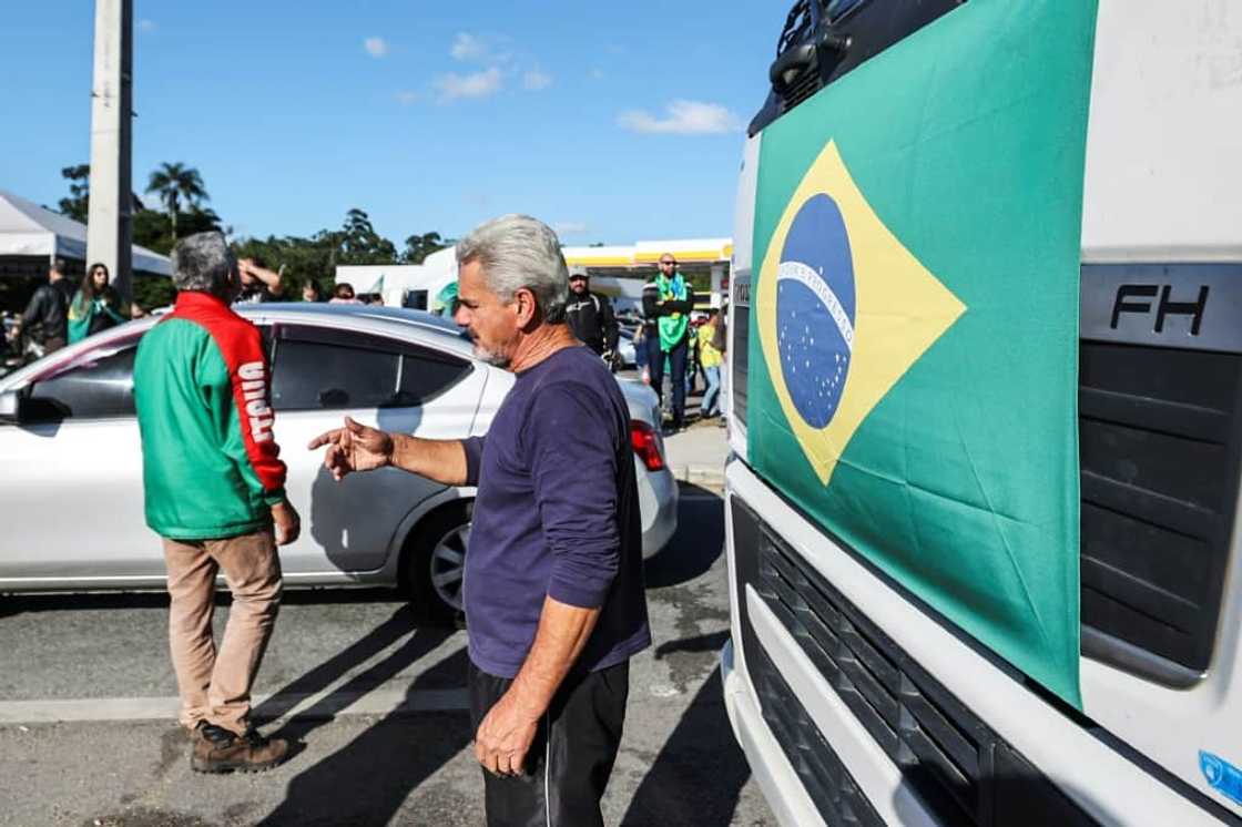 Supporters of Brazilian President Jair Bolsonaro at a road blockade after his election defeat Supporters of Brazilian President Jair Bolsonaro at a road blockade after his election defeat