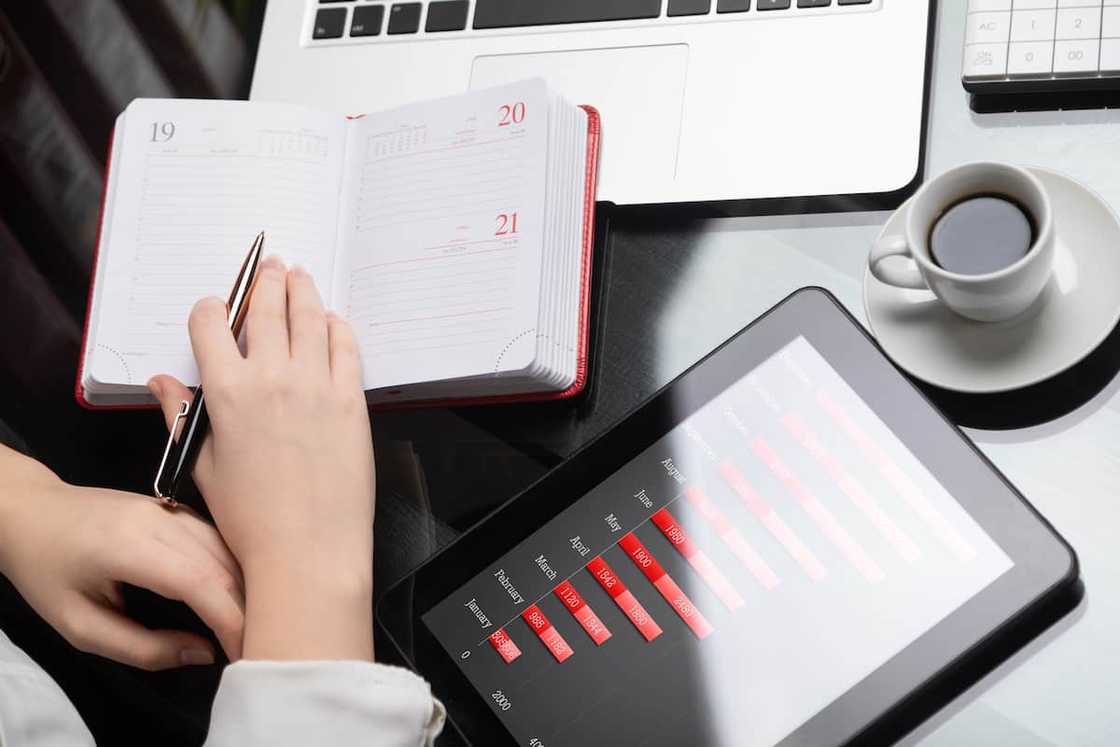 A woman writing in a diary