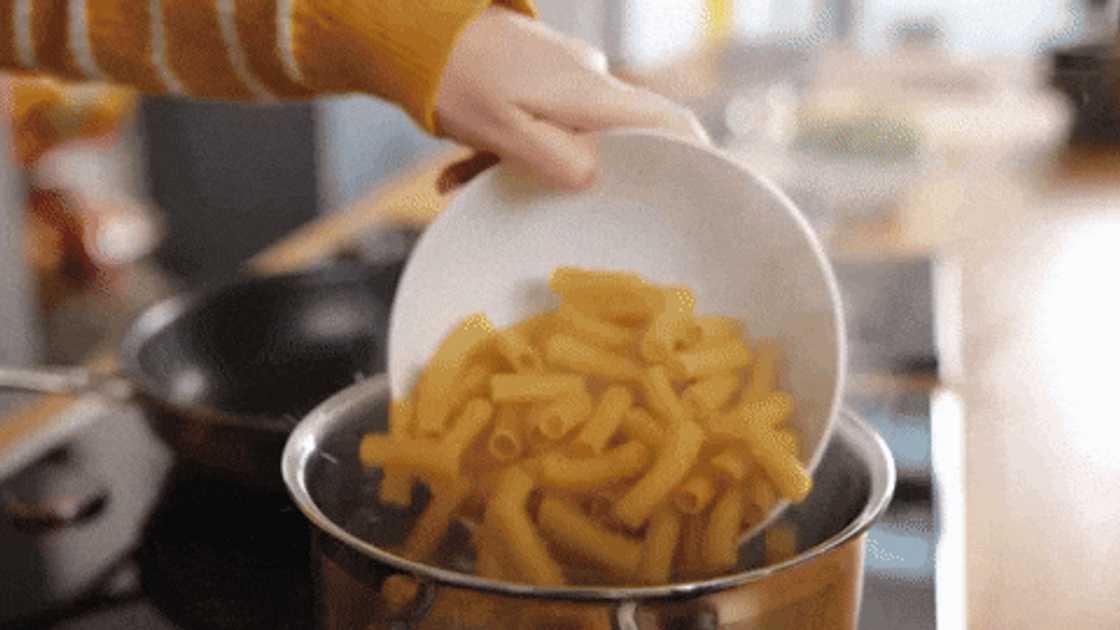 Preparing veggie pasta bake Preparing veggie pasta bake