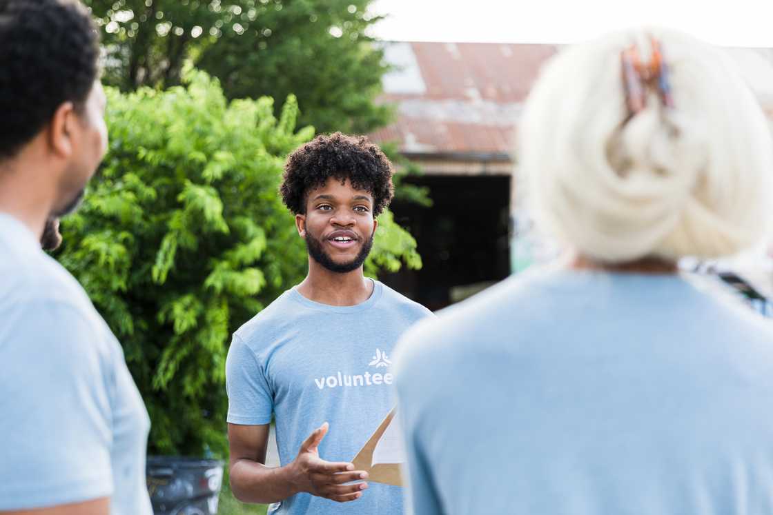 A man addressing a group of people