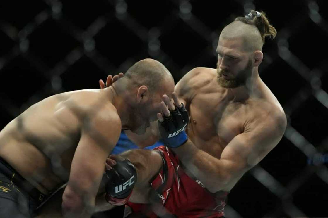 Jiri Prochazka, right, became the first UFC world champions from the Czech Republic when he beat Brazil's Glover Teixeira, left, in Singapore in June Jiri Prochazka, right, became the first UFC world champions from the Czech Republic when he beat Brazil's Glover Teixeira, left, in Singapore in June
