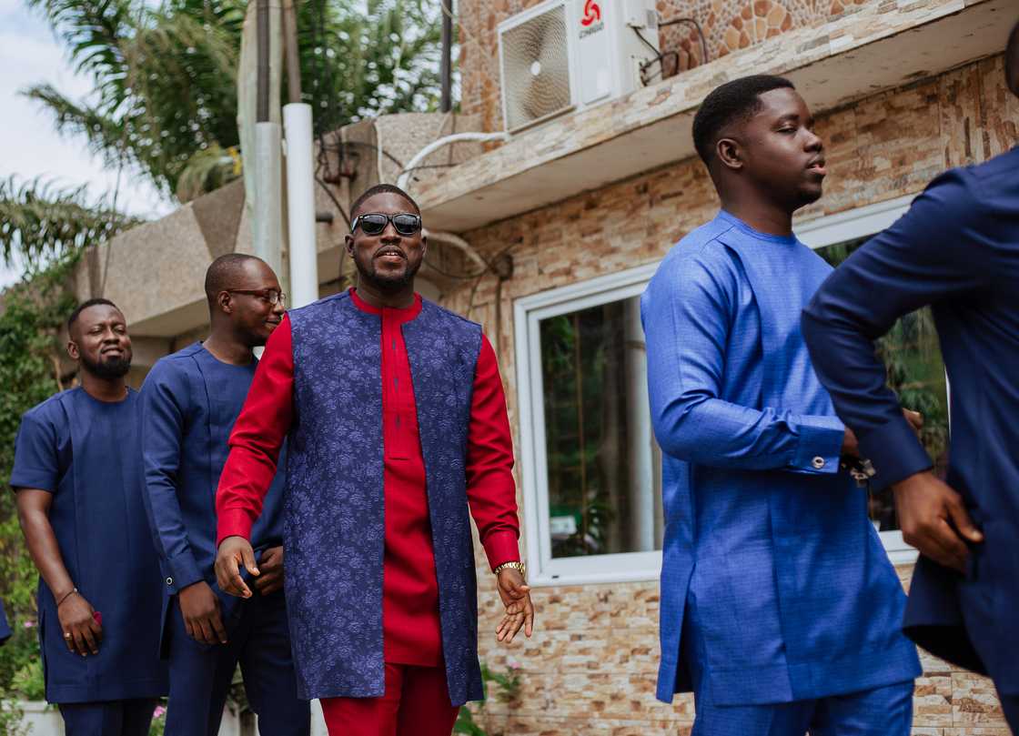 A group of friends and family dancing on a street. A group of friends and family dancing on a street.