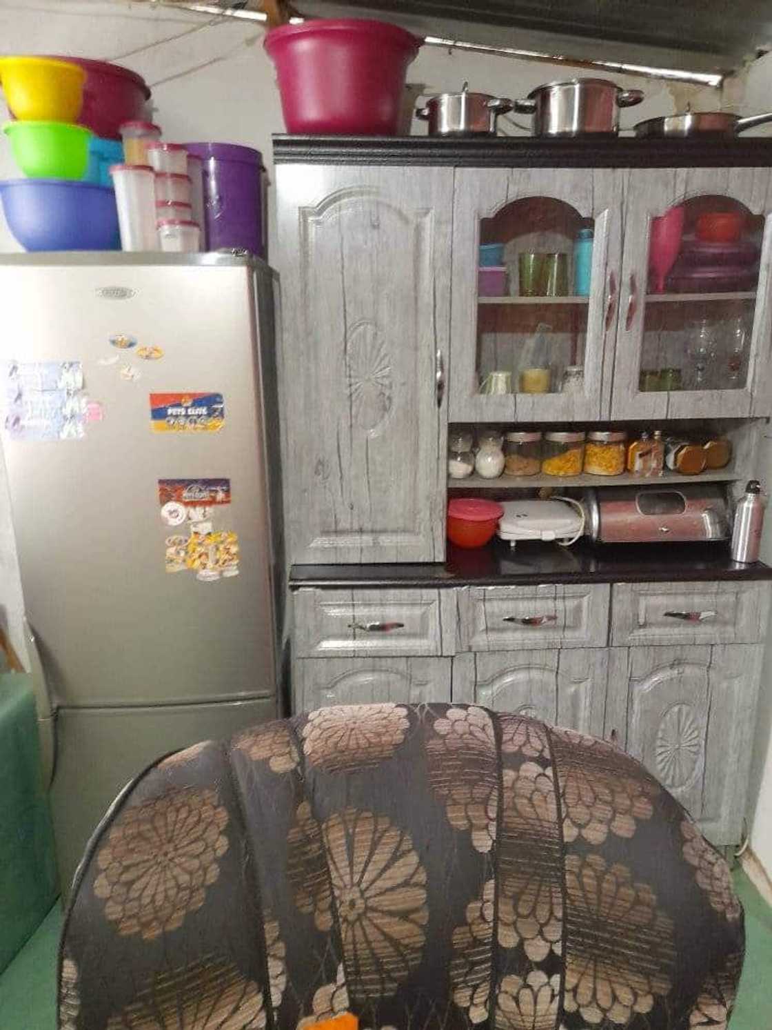 Woman shows her kitchen.