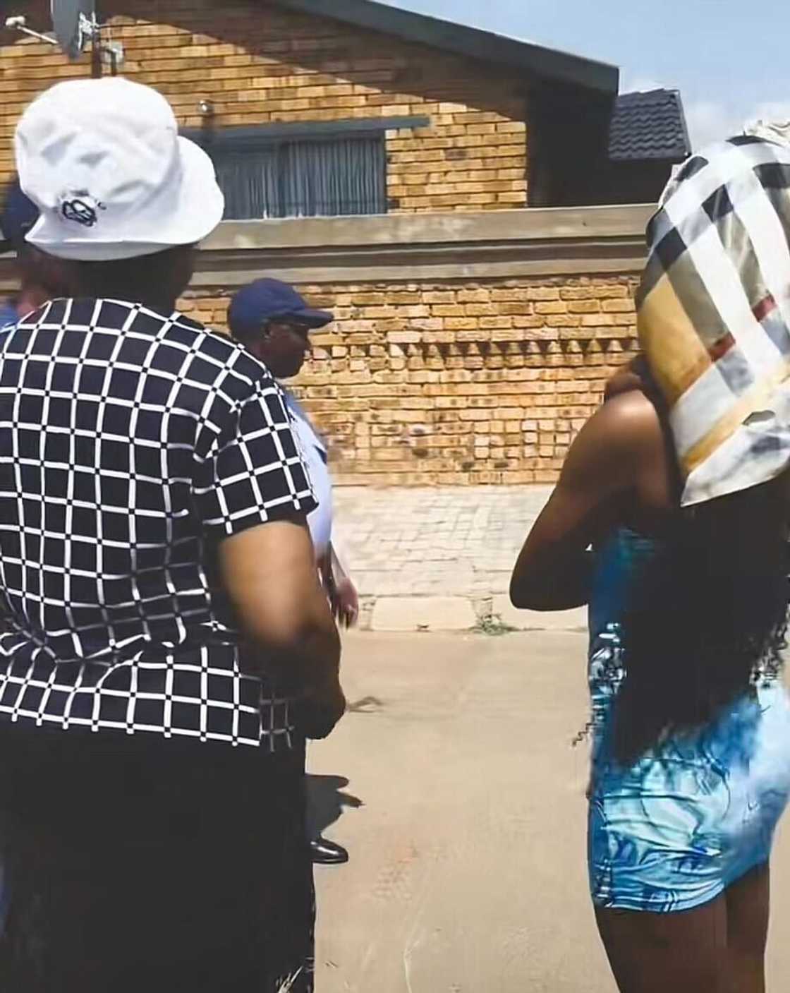 In a TikTok video, a woman is seen being questioned by the police after pranking her grandparents.