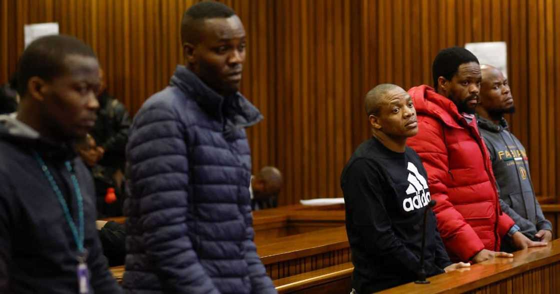 Five accused men in the Senzo Meyiwa murder trial stand in the dock at Pretoria High Court