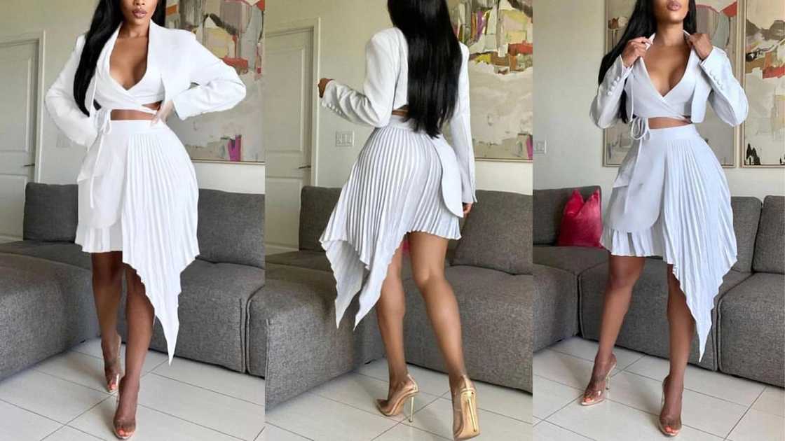 Two-piece high waist pleated skirt with asymmetrical hem and long-sleeved crop top Two-piece high waist pleated skirt with asymmetrical hem and long-sleeved crop top