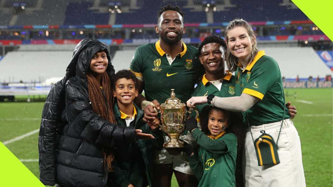 Siya Kolisi celebrates winning the Rugby World Cup with Rachel Smith and family.