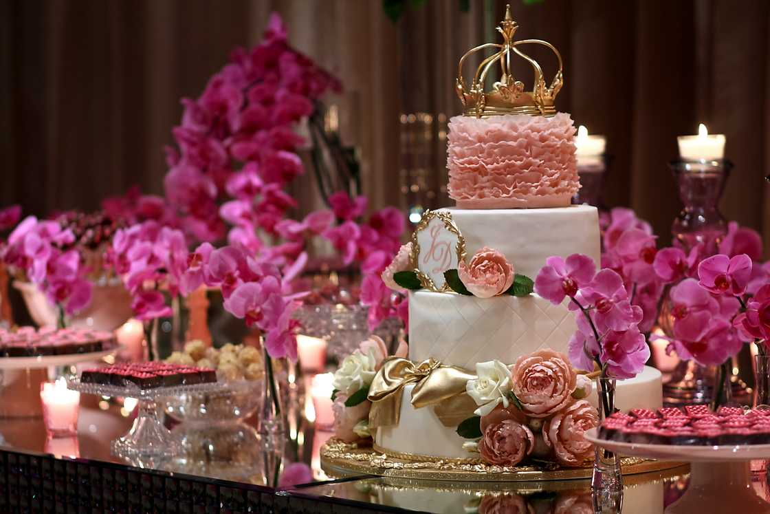 A three tier pink and gold cake A three tier pink and gold cake