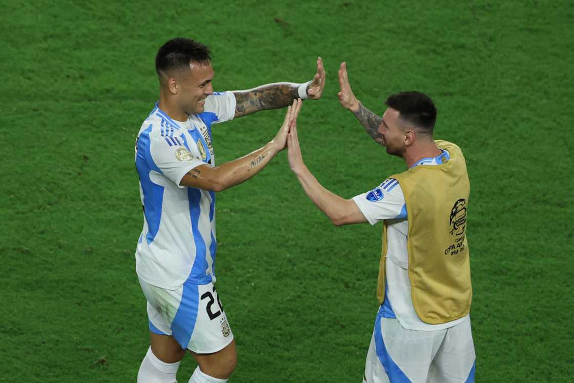 Lautaro Martinez celebrating with Lionel Messi