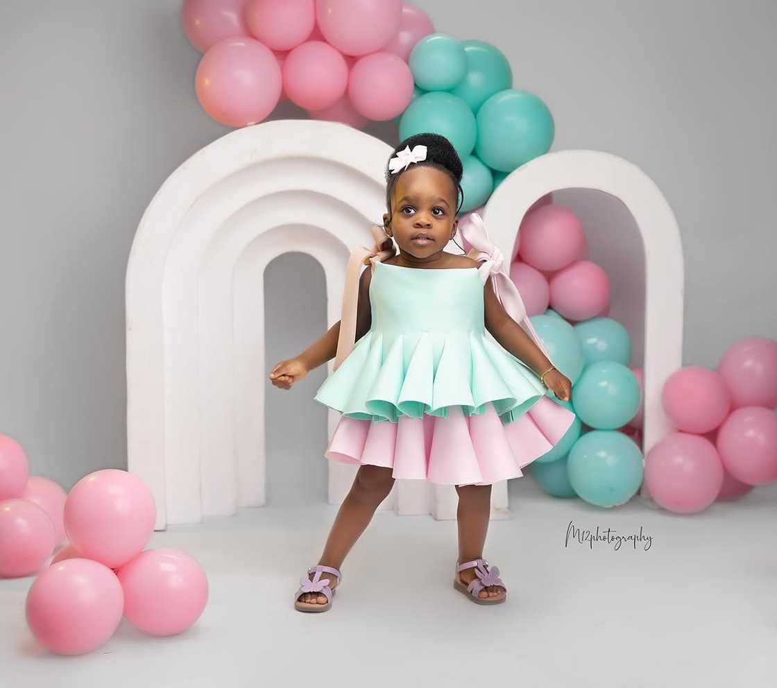 A two-year-old girl celebrates her birthday.