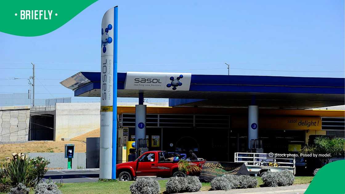 The distinctive blue and white Sasol totem sign stood tall near the entrance of the service station forecourt