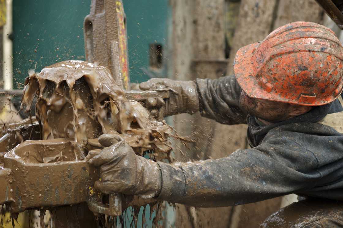 A roughneck at work at a drilling site