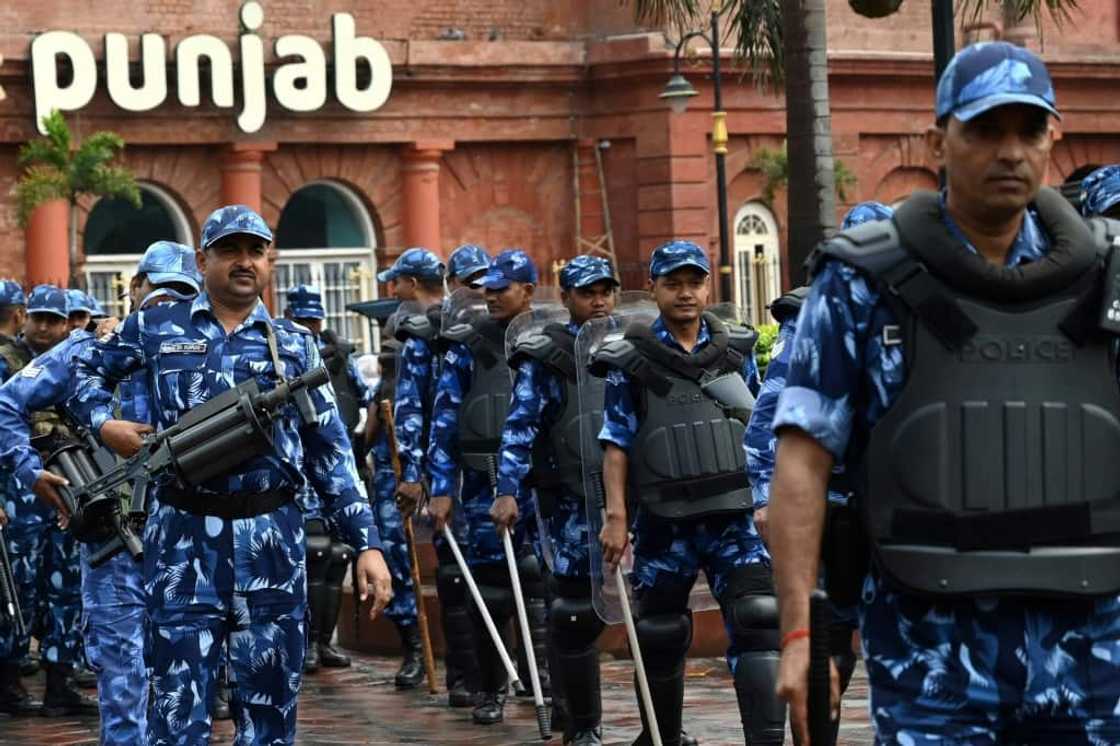 Security personnel patrol a street in Amritsar in the northern Indian state of Punjab during a search for a radical Sikh preacher