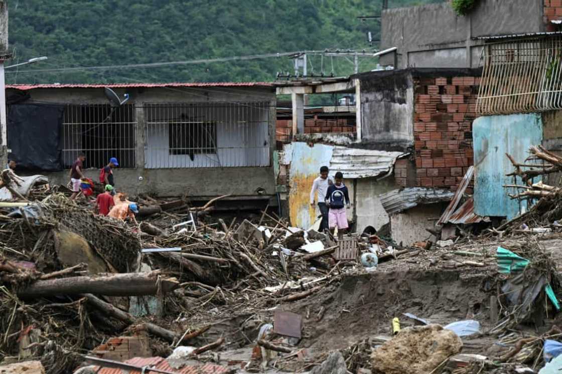 The landslide, caused by the biggest river flood in the area in 30 years, is the worst so far this year in Venezuela, which has seen historic rain levels in recent months The landslide, caused by the biggest river flood in the area in 30 years, is the worst so far this year in Venezuela, which has seen historic rain levels in recent months