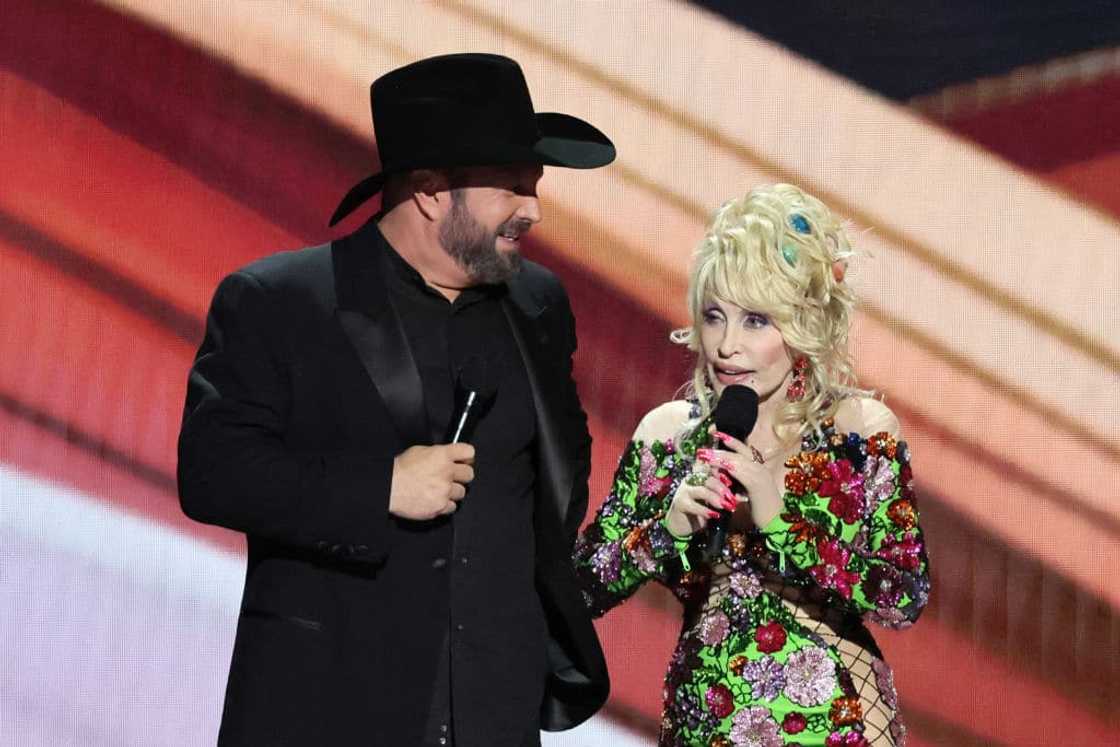 Garth Brooks and Dolly Parton on stage during the 58th Academy Of Country Music Awards at The Ford Center at The Star Garth Brooks and Dolly Parton on stage during the 58th Academy Of Country Music Awards at The Ford Center at The Star