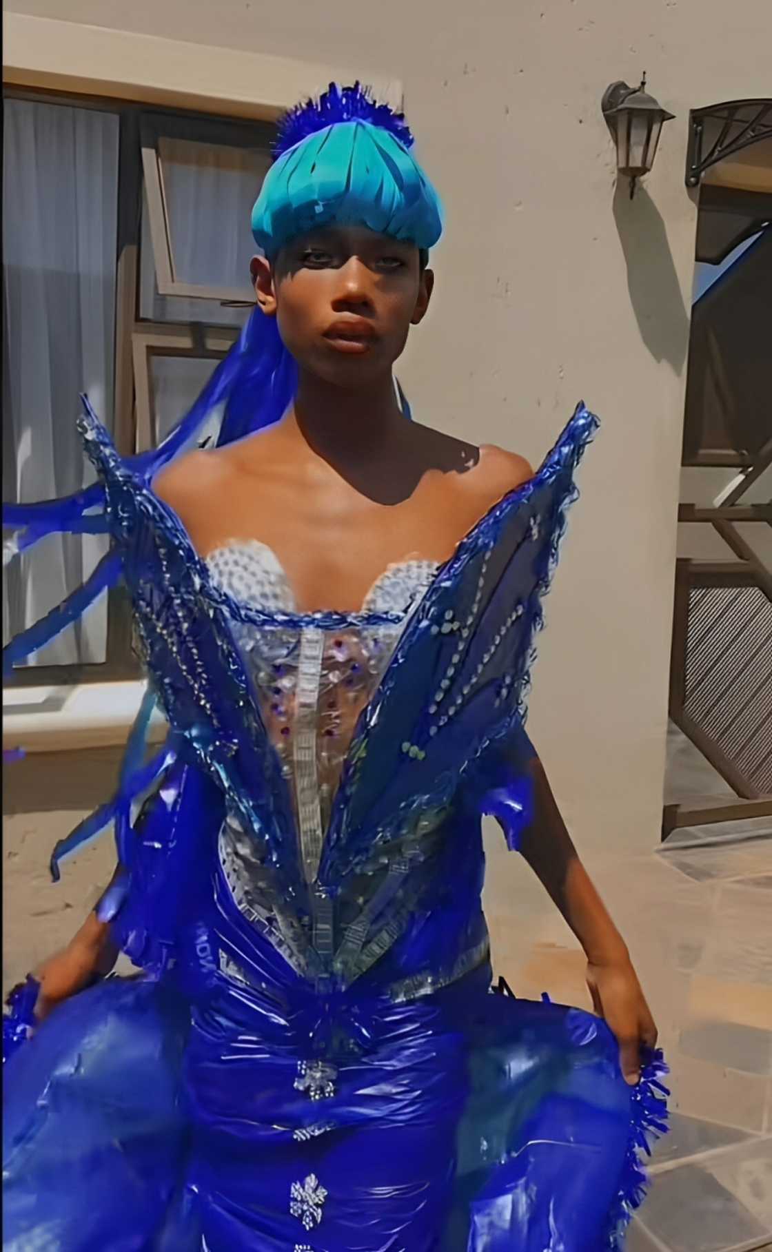 A young South African man showed off his amazing dress creation from plastics. A young South African man showed off his amazing dress creation from plastics.