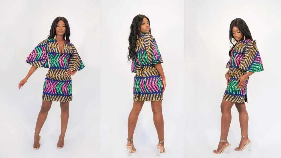 Short Ankara gown with deep V-neckline and puffy sleeves Short Ankara gown with deep V-neckline and puffy sleeves