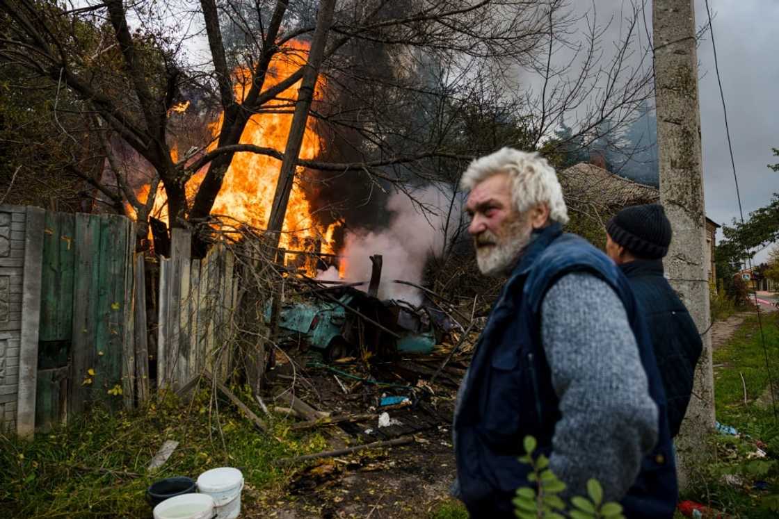 A structure on fire after shelling in the town of Bakhmut, in eastern Ukraine's Donbas region, on October 23, 2022, amid Russia's military invasion of Ukraine