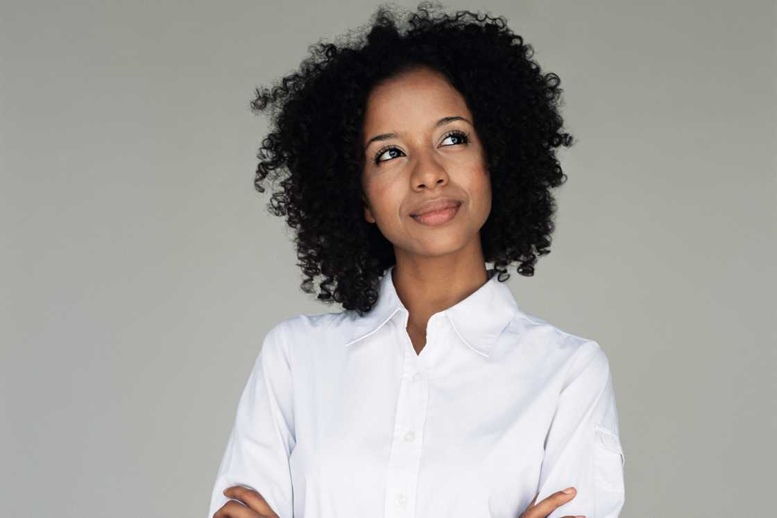 A black woman is contemplating