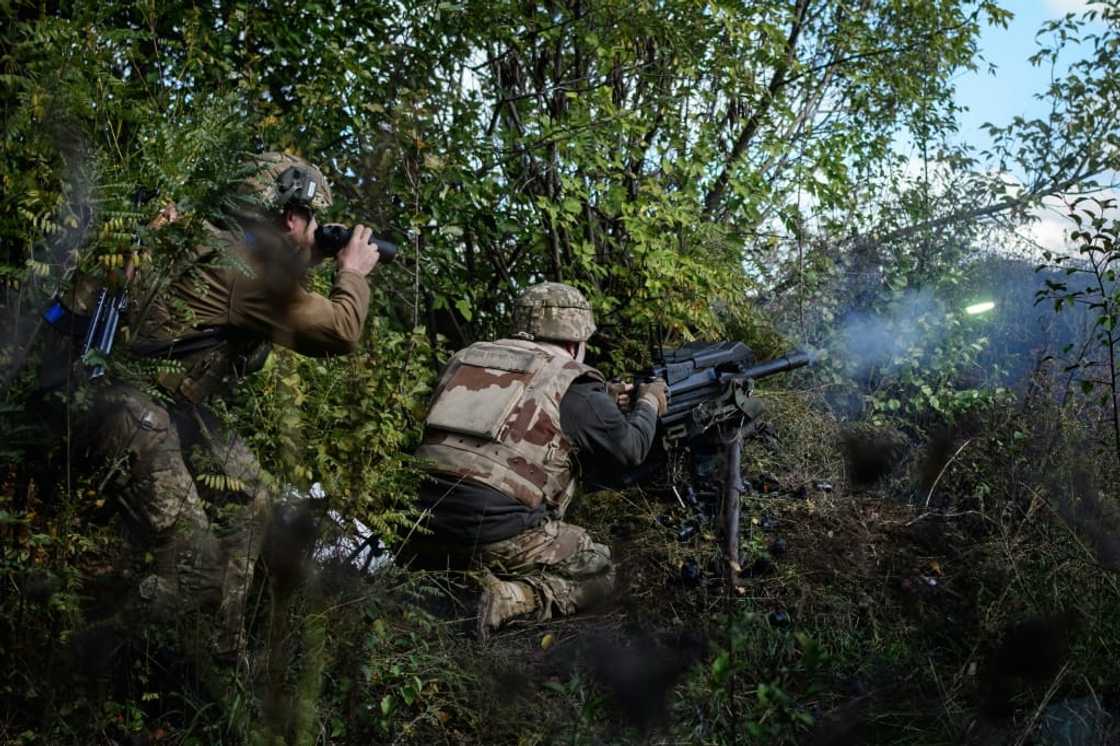 Soldier of Ukraine's 5th Regiment of Assault Infantry react after firing a US-made MK-19 automatic grenade launcher towards Russian positions in less than 800 metres away at a front line near Toretsk in the Donetsk region Soldier of Ukraine's 5th Regiment of Assault Infantry react after firing a US-made MK-19 automatic grenade launcher towards Russian positions in less than 800 metres away at a front line near Toretsk in the Donetsk region