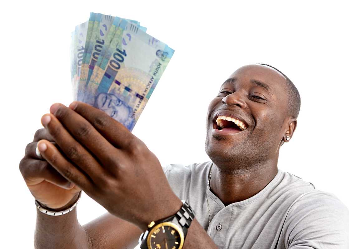 A man is ecstatic after receiving money. South Africans are eager to draw out from their retirement savings since the launch of the Two-Pot system.