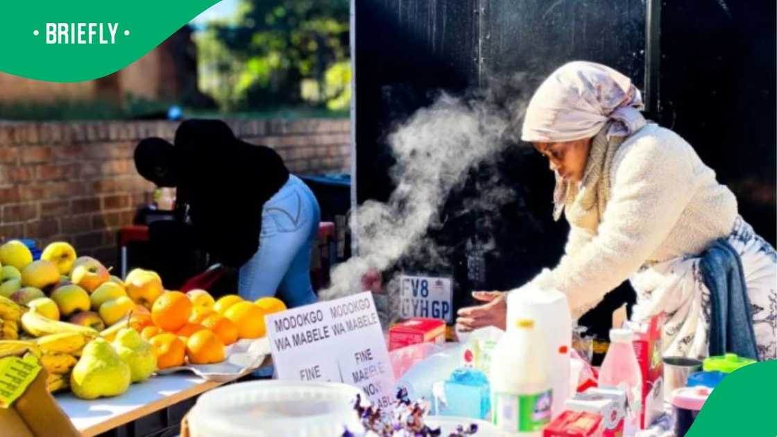 The image captured Vutomi preparing food for her customers The image captured Vutomi preparing food for her customers