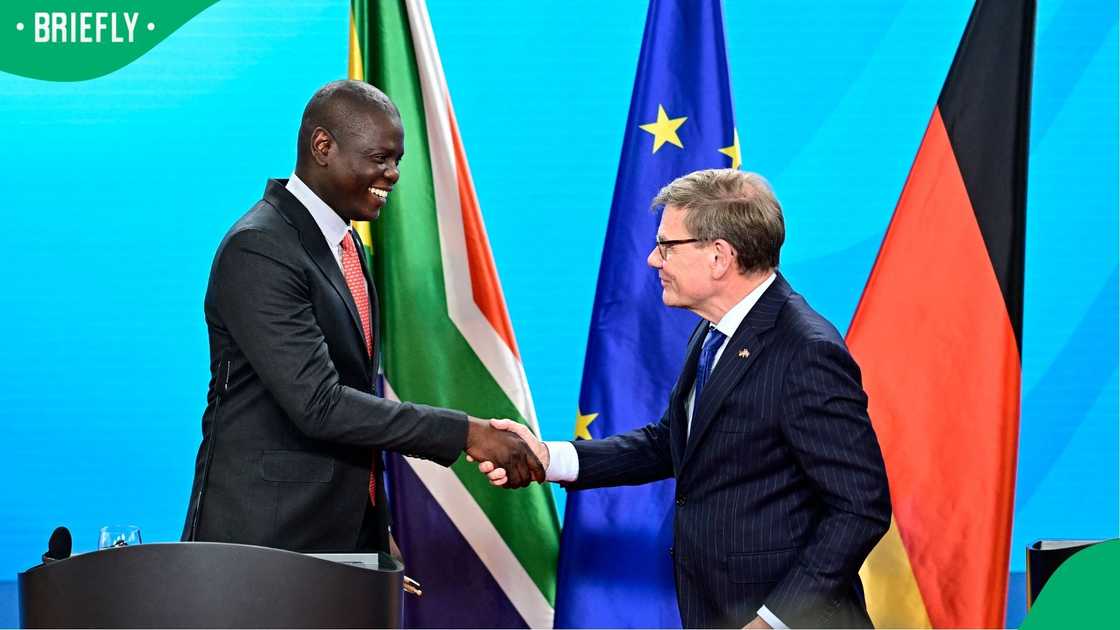 German Foreign Minister Johann Wadephul shakes hands with his South African counterpart, Ronald Lamola