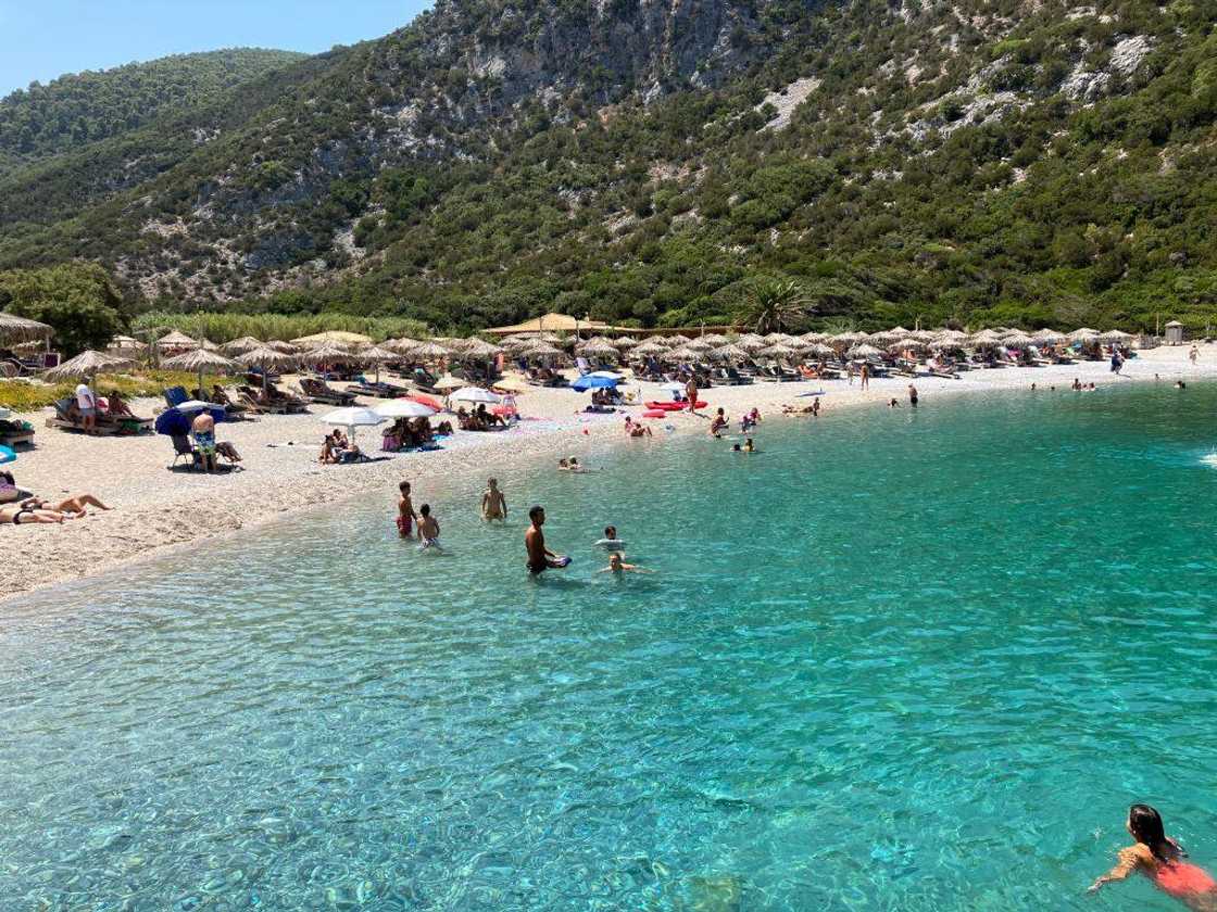 People spending the hot summer day on Sporades island of Skopelos