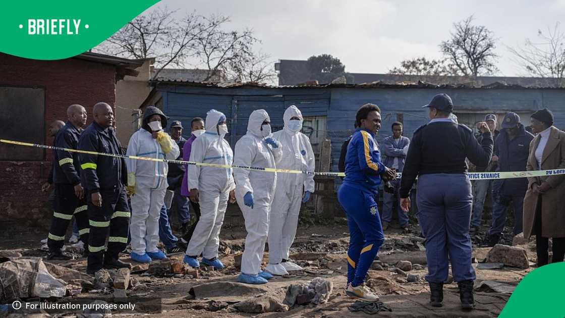 An investigation is conducted at the scene following the attack that at least 12 people were killed and nine others injured in a shooting at the informal settlement of Jumpers in the Cleveland area of Johannesburg An investigation is conducted at the scene following the attack that at least 12 people were killed and nine others injured in a shooting at the informal settlement of Jumpers in the Cleveland area of Johannesburg