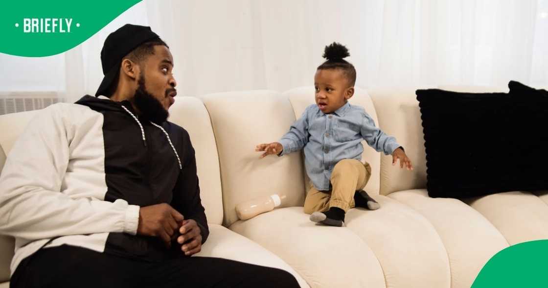 Kid playing kung fu kicks father's phone into the air Kid playing kung fu kicks father's phone into the air