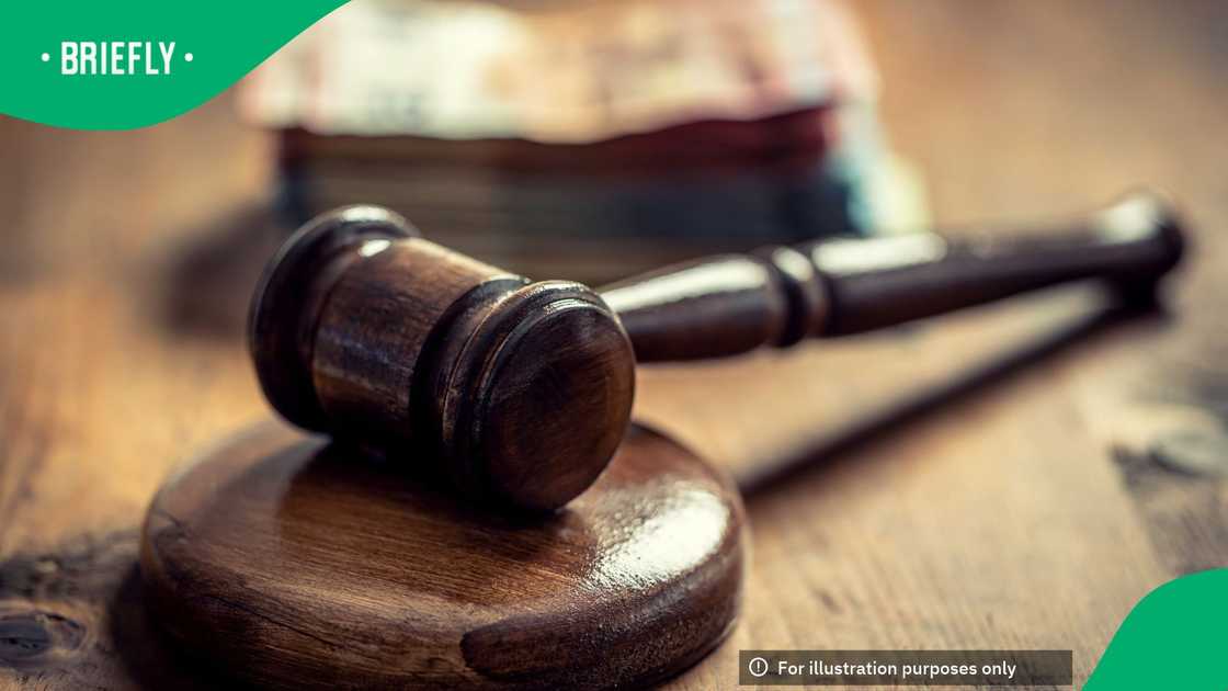 A picture of a gavel and money
