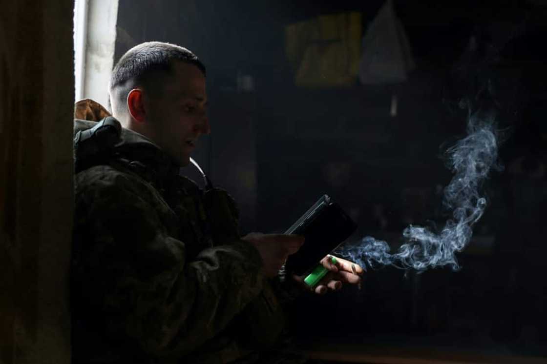 A Ukrainian soldier smokes a cigarette as he rests at a frontline in the Donetsk region A Ukrainian soldier smokes a cigarette as he rests at a frontline in the Donetsk region