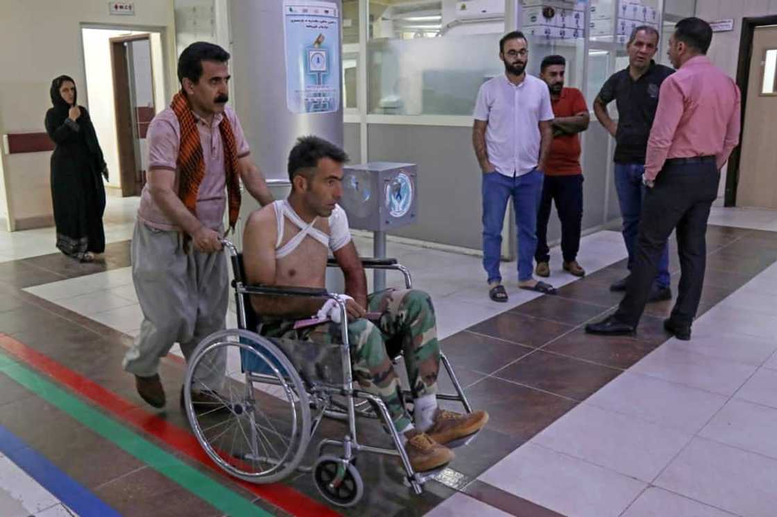A wounded manat a hospital following strikes by Iran on the village of Altun Kupri, south of the capital Arbil, in Iraq's autonomous Kurdistan region on September 28, 2022 A wounded manat a hospital following strikes by Iran on the village of Altun Kupri, south of the capital Arbil, in Iraq's autonomous Kurdistan region on September 28, 2022