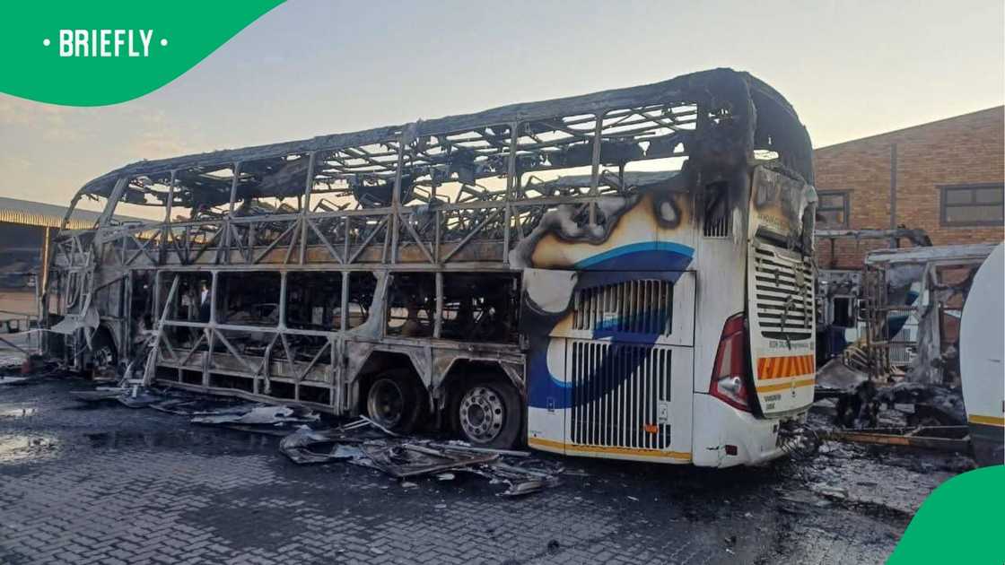 The shell of a bus destroyed in the blaze