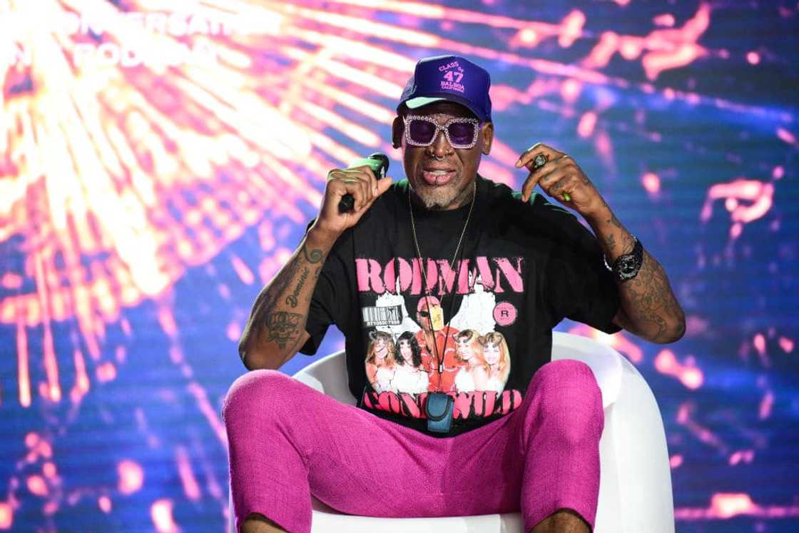 Dennis Rodman speaking on stage Dennis Rodman speaking on stage