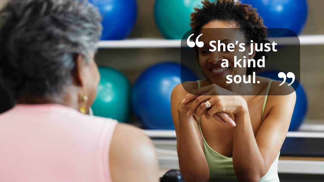 Women having a light conversation indoors Women having a light conversation indoors