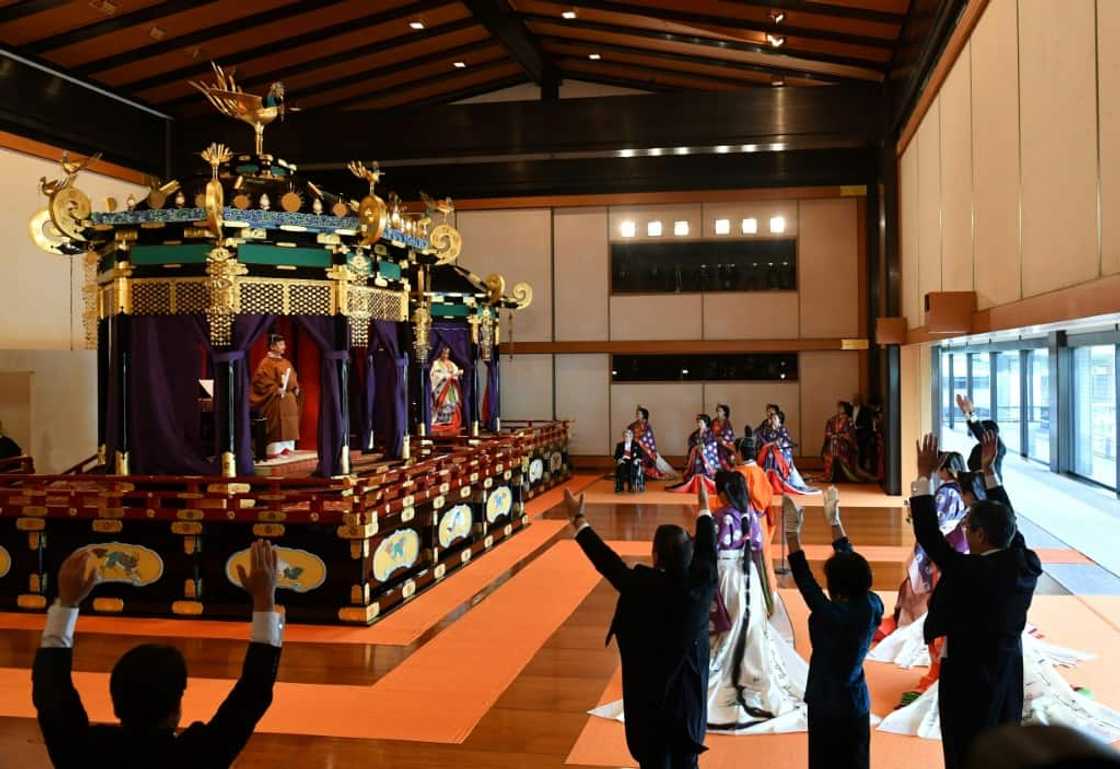 Japan's Abe assisted in the tradition-bound official ascension to the throne of the new emperor, leading a cheer of Banzai! Japan's Abe assisted in the tradition-bound official ascension to the throne of the new emperor, leading a cheer of Banzai!