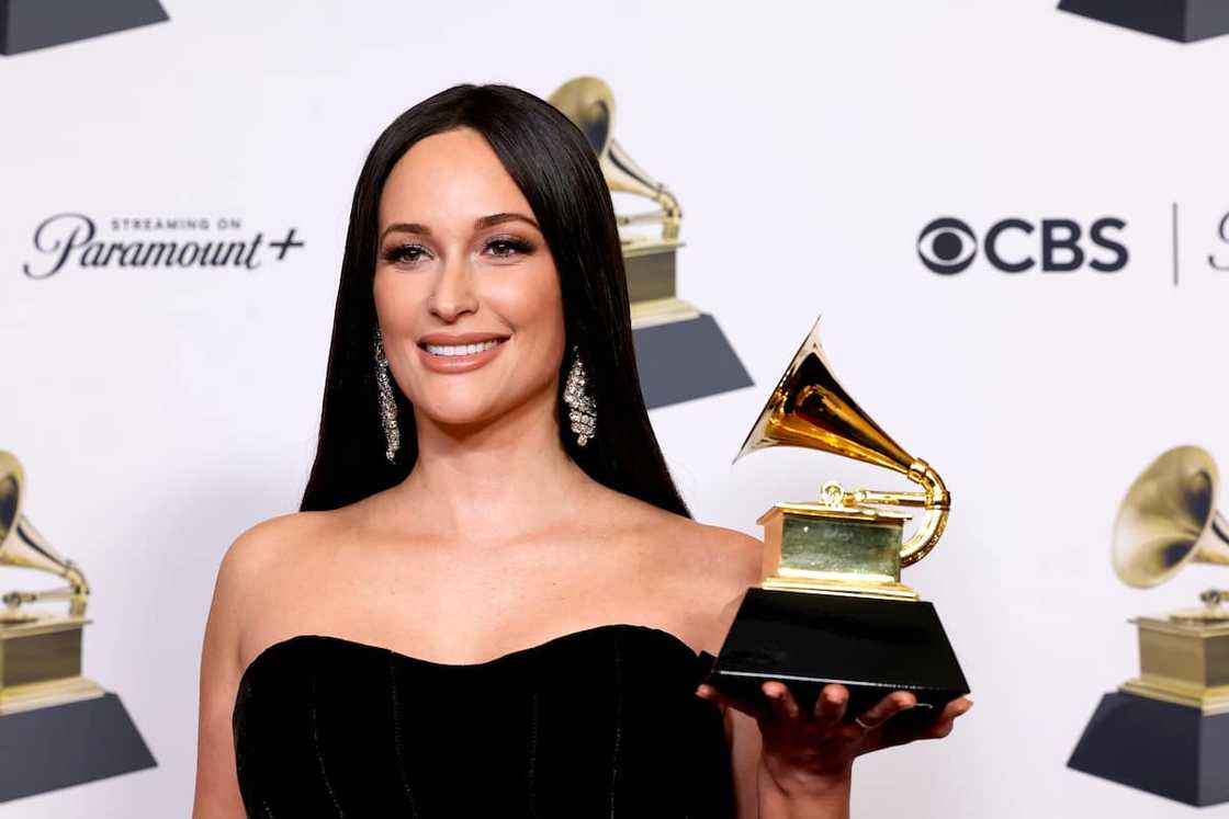 Kacey Musgraves with an award