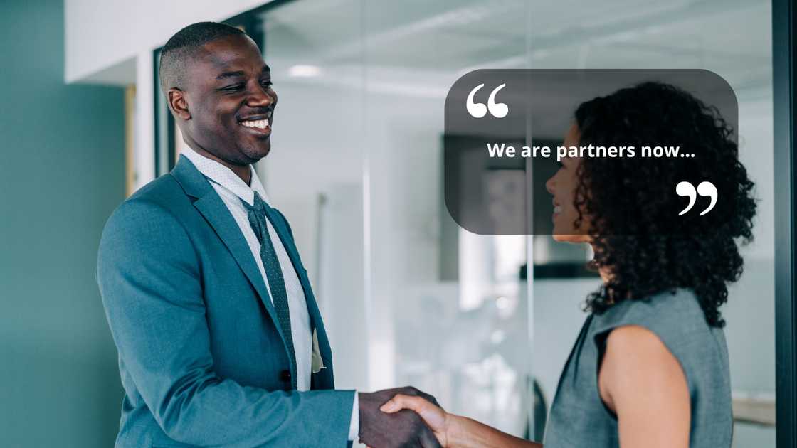 A man and woman shaking hands