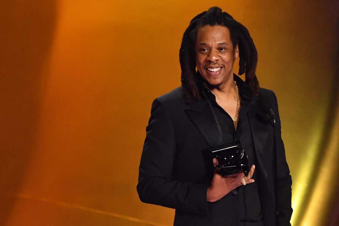 Jay-Z accepts the Dr. Dre Global Impact Award on stage during the 66th Annual Grammy Awards Jay-Z accepts the Dr. Dre Global Impact Award on stage during the 66th Annual Grammy Awards