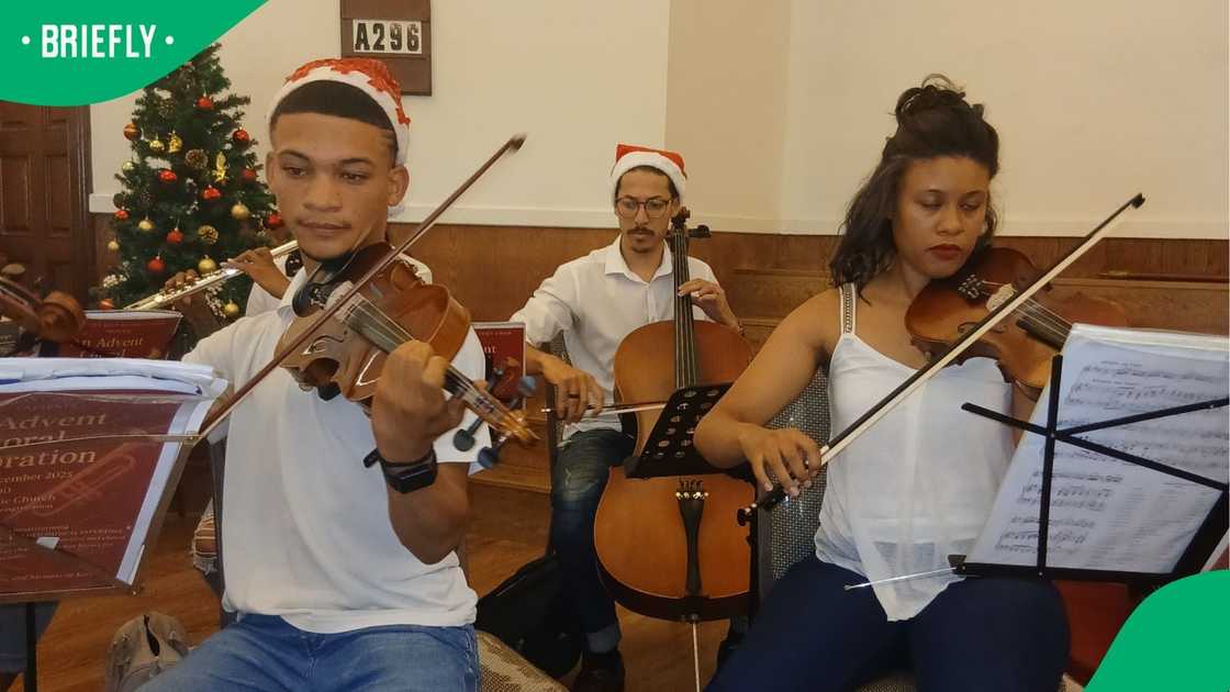 Teen violinist and two other musicians in a church.