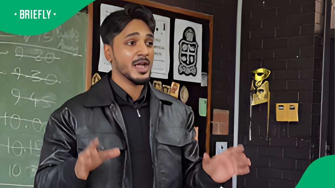 The educator sang passionately in front of the chalkboard while students joined in The educator sang passionately in front of the chalkboard while students joined in